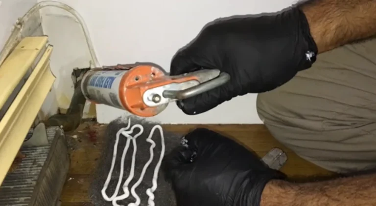 Home 8 Technician sealing a gap to help prevent rodent entry